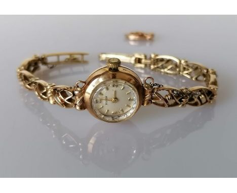 A mid century Tissot ladies manual wristwatch with a 9ct yellow gold case and bracelet, hallmarked, 13.83g without mechanism,