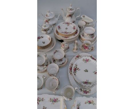 A seventy piece Royal Albert 'Moss Rose' tea and part dinner service comprising: tea cups/saucers x 10 each, 9 side plates, l