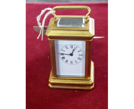 A brass carriage clock with keywind movement and enamel dial, 9cm high