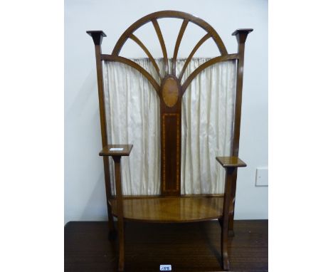 An Edwardian Arts and Crafts style inlaid mahogany fire-screen of pierced arched form with pleated back cloth and split level