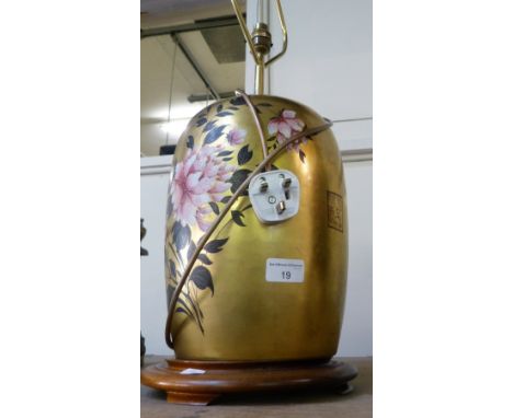 An oriental gilt table lamp with floral decoration