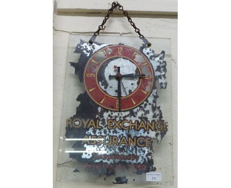 A Royal Exchange Assurance clock on a glass panel