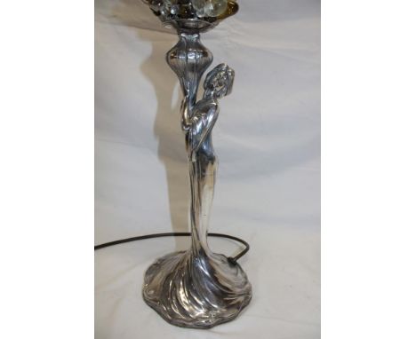 An unusual Art Nouveau WMF table lamp in the form of a stylized female with unusual period glass shade of individual glass be