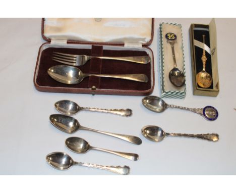 A silver gilt commemorative Elizabeth II coronation teaspoon in presentation case, silver christening fork and spoon in velve