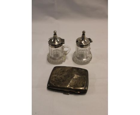 A pair of silver mounted cut-glass condiment bottles and a damaged silver rectangular cigarette case with engraved decoration