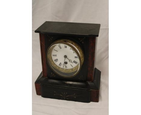A Victorian mantel clock with circular enamelled dial in black slate and marble angular case
