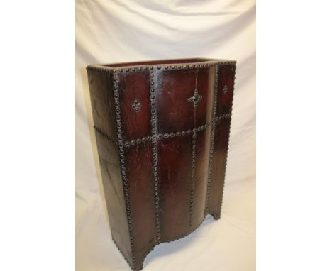 A 1930's Art Deco embossed leather rectangular stick-stand decorated with brass headed nails, 29" high x 19" wide