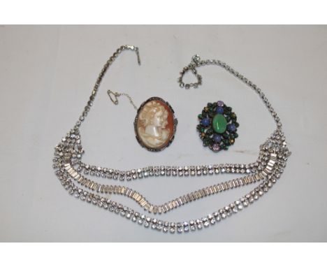 A silver oval brooch mounted with jade and semi-precious stone, silver oval brooch with cameo portrait panel and a decorated 