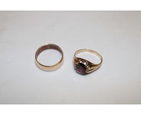 A 9ct gold wedding band and a 9ct gold dress ring set garnets (2) (7.5g)