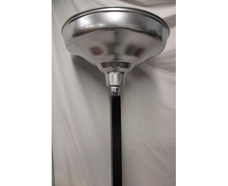 An Art Deco black painted wood angular standard lamp with aluminium up-lighting shade, 68" high
