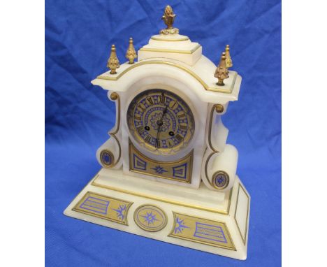 A 19th century French mantel clock with gilt decorated circular dial in polished white marble and brass mounted arched case