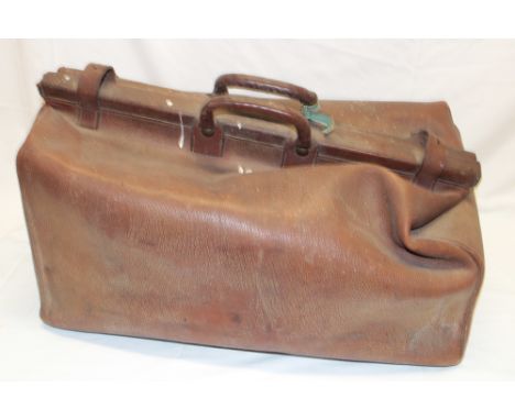 A large brown leather Gladstone bag by J. K. Bridge of London