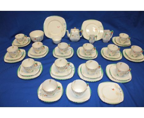 A 1930's Burleigh Art Deco tea set with butterfly and floral decoration comprising fourteen angular tea cups with floral hand