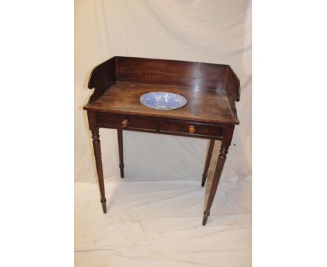 A Victorian mahogany rectangular wash stand with inset bowl recess supporting a blue and white ceramic bowl, two dummy drawer