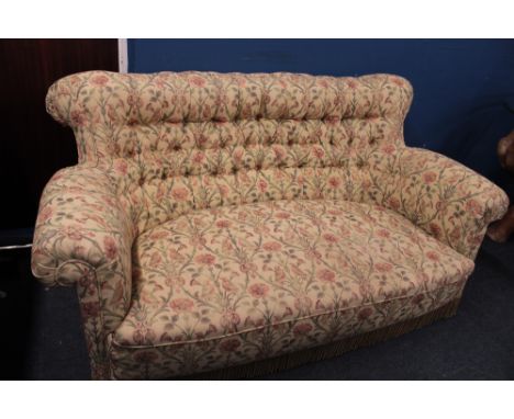 A good quality old three-seat sofa upholstered in floral buttoned fabric, 67" long