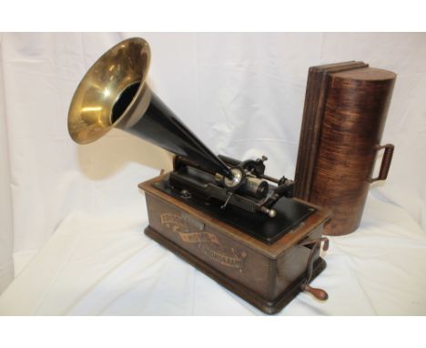 An Edison home phonograph "Model C" with brass and painted metal horn and domed oak cover, 18½" long