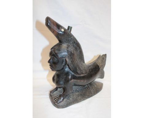 An unusual Eastern carved wood lamp base in the form of a mermaid and fish 9½" long