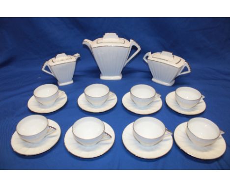 A Limoges china Art Deco tea set comprising angular tapered white glazed  tea pot with silver edging, matching two-handled su