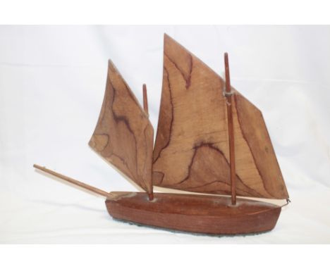 A hand crafted wooden model of a Cornish fishing boat 16" long