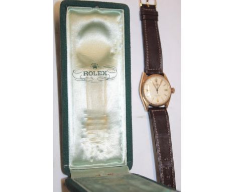 A gentleman's vintage 14ct gold wristwatch by Rolex "Rolex Oyster Perpetual Officially Certified Chronometer" with silvered d
