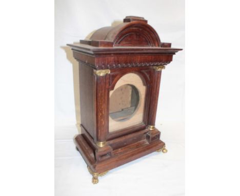 A good quality oak bracket clock case with fluted columns and brass mounts 19" high