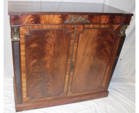 A 1960's Pye stereogram with BSR turntable and speaker contained within a reproduction mahogany brass mounted Regency-style c