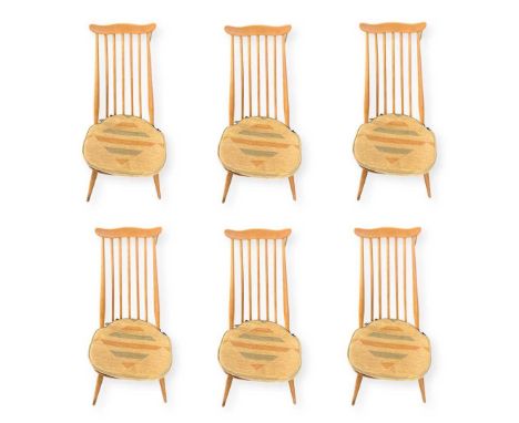 A Set of 6 Stick Back Ercol Dining Chairs with cushions. 