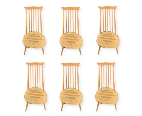 A Set of 6 Stick Back Ercol Dining Chairs with cushions. 