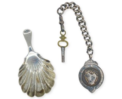 Mixed Lot. Silver Caddy Spoon and a Silver Fob and Chain. 32 g. London 1909, Josiah Williams and Co. Caddy spoon has scallopp