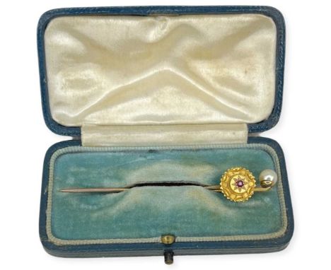 Two 9 ct Gold Lapel/Tie Pins. 3 g. One with inset garnet and the other with a pearlNo issues