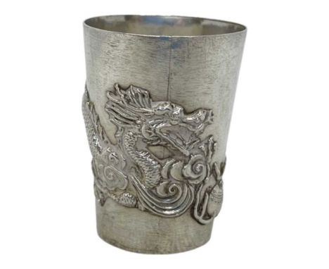 Chinese Silver Tot Cup. 15 g. Marks to Base. Dragon decoration to body.Height 4.2 cms