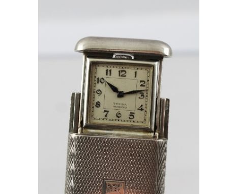 A "TEXINA IMPERVO" POCKET WATCH, the square dial and movement retract into a white metal vesta type case, with engine turned 
