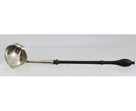 A GEORGE II SILVER TODDY LADLE the bowl with opposing pouring lips, London 1747, mounted on a ring turned wood handle, 32cm 