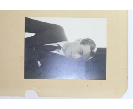 A PORTRAIT PHOTOGRAPH OF A YOUNG GENTLEMAN, inscribed and dated 1938, signed Beaton (Cecil Beaton) to the mount, 20cm x 15cm 