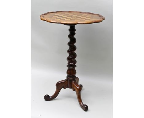 A VICTORIAN ROSEWOOD GAMES TABLE having fluted moulded rim with inlaid chequerboard top, on barley twist stem and tripod scro