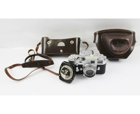 A LEICA M3 35mm FILM CAMERA, with Leitz Wetzlar lens and light meter, camera bears no. 1071700, in leather case 