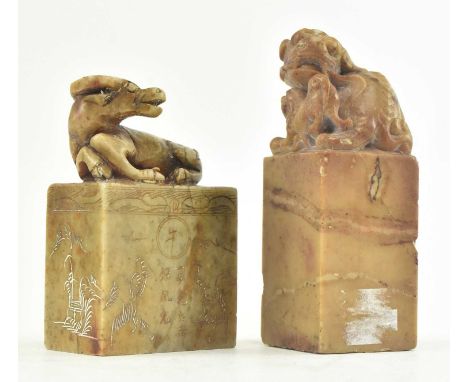 Two Chinese 20th century hand carved stone seal stamps. The lot comprising a marble seal stamp with Foo dog finial, and anoth