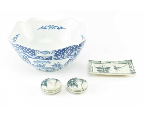 A collection of four Japanese vintage ceramic blue and white pieces. The lot to include a large four-sectioned blue and white