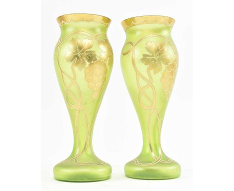 A pair of early 20th century likely Austrian Art Nouveau green glass lustre vases. Each vase of tapering form on thin squat b