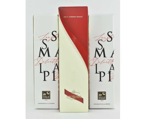 Three vintage boxed bottles of wine. The lot comprising a vintage bottle of G. H. Mumm champagne, undated, 12% 750ml; and two