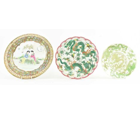 A collection of three vintage Chinese ceramic plates. The lot to include a famille rose enamelled charger decorated with two 