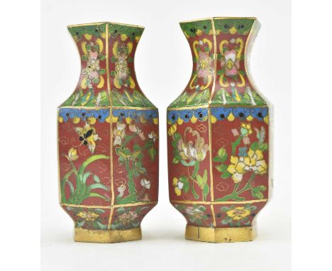 A pair of 19th century Chinese small cloisonne enamelled vases of hexagonal form. The vases on maroon ground with enamel flor