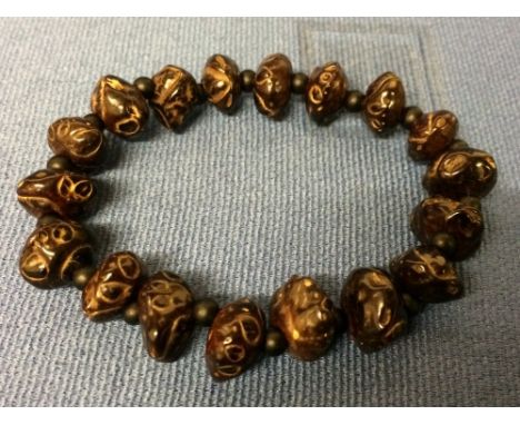 Chinese carved bangle and Tibetan necklace carved from shells