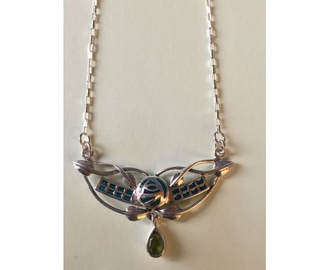 Silver and enamel necklace with peridot drop, in the Art Nouveau style