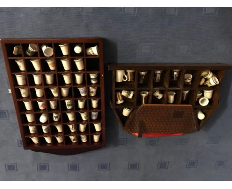 Large collection of ceramic thimbles in 3 glazed cabinets and 2 open shelves