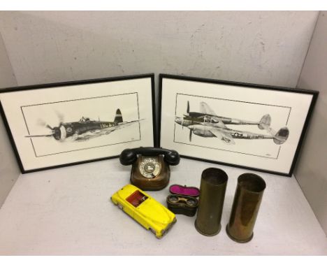 Vintage brass & Bakelite handle telephone, tin plated toy car, 2 brass artillery shells & a pair of prints of war planes