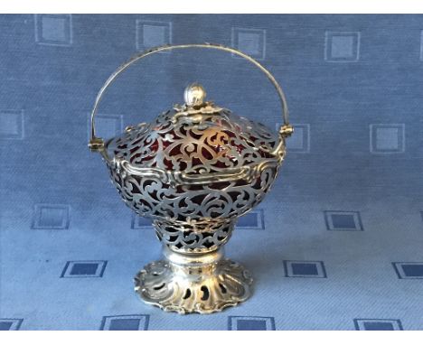 Early Victorian hallmarked silver pierced fretwork bon bon basket with swing handle, ruby glass liner and pierced fretwork li