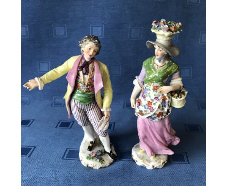 Pair of Continental ceramic figurines of a lady & gentleman, blue marks to base, 20/22cmH