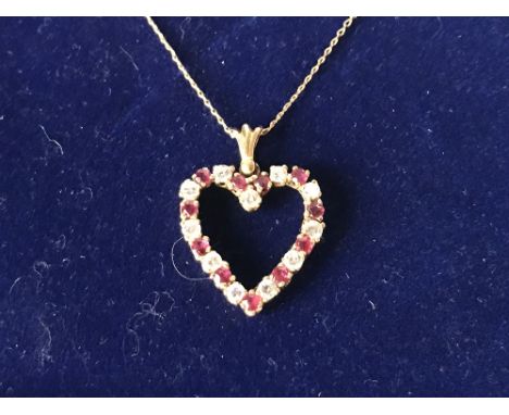 14 carat yellow gold, ruby and diamond heart shaped pendant necklace on gold chain