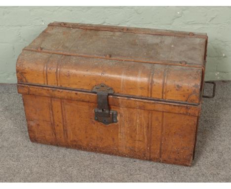 A vintage twin handle tin trunk.  
